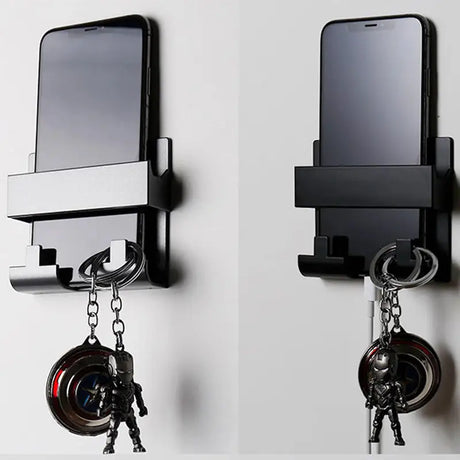 two cell phones hanging on a wall with a key