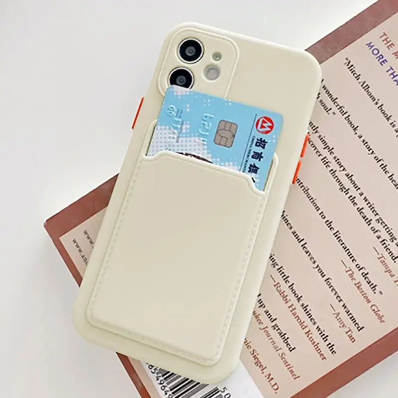 a white phone case with a credit card