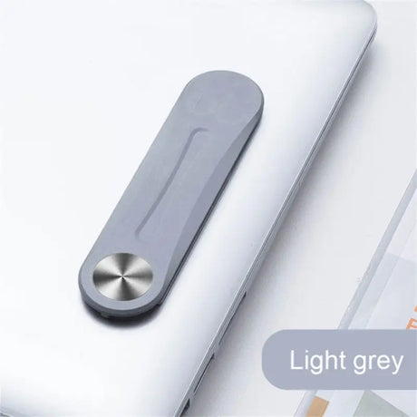a laptop with a pen and a pen on top of it