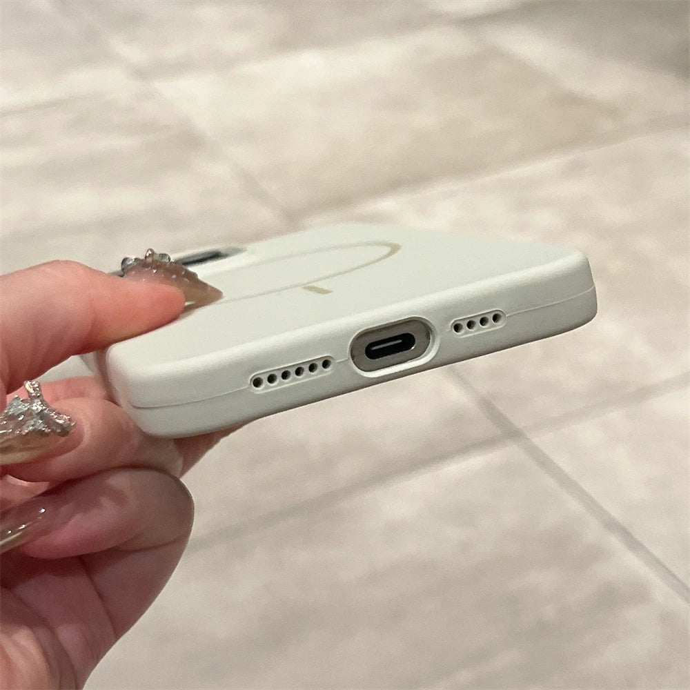 White phone case with charging port and speaker holes.