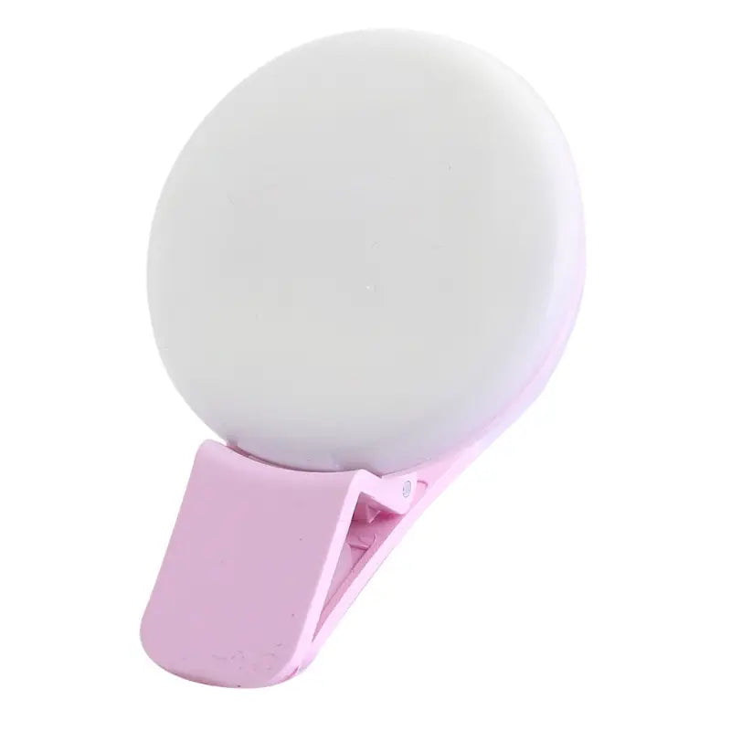 a pink and white ball on a white background