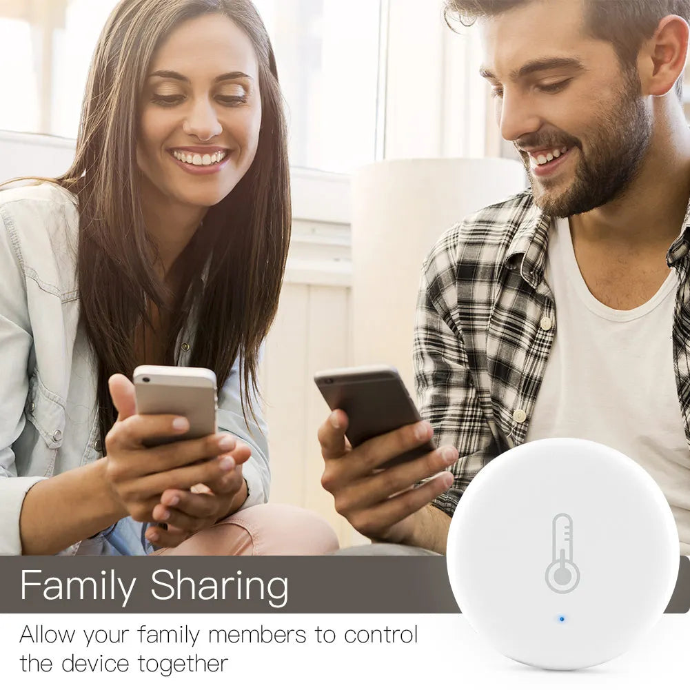 White, round smart home device with thermometer icon.