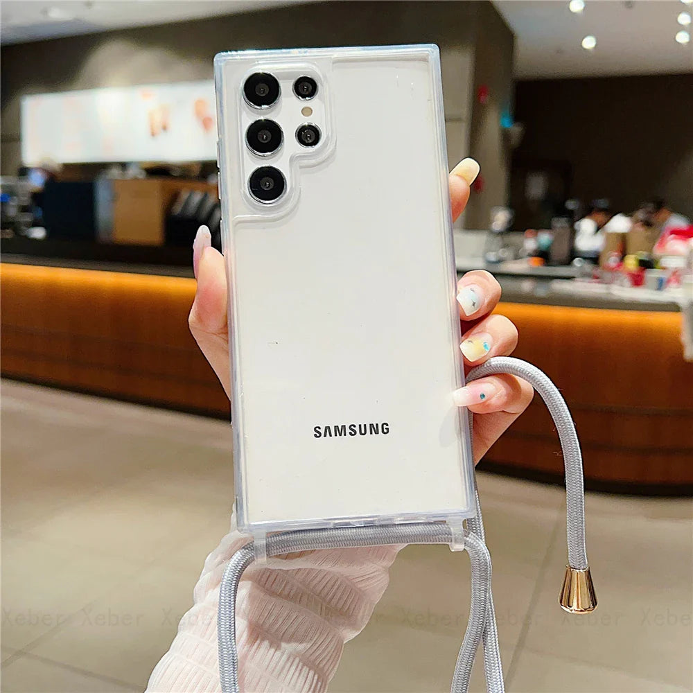 White smartphone in a clear case with a gray lanyard.