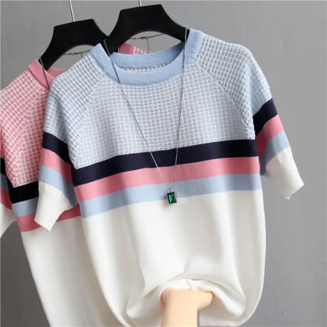 a white sweater with pink and blue stripes