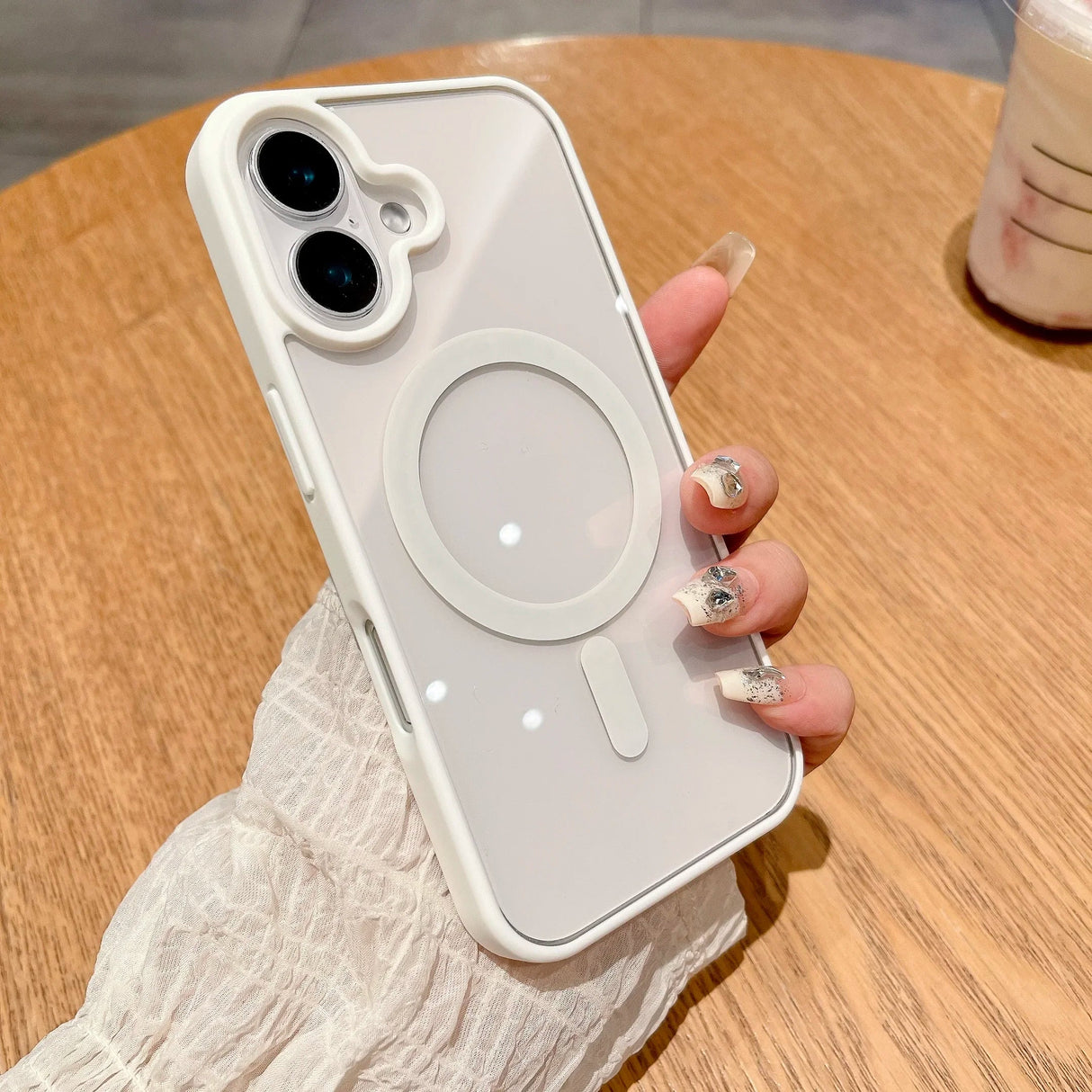 White-trimmed clear phone case with MagSafe ring.