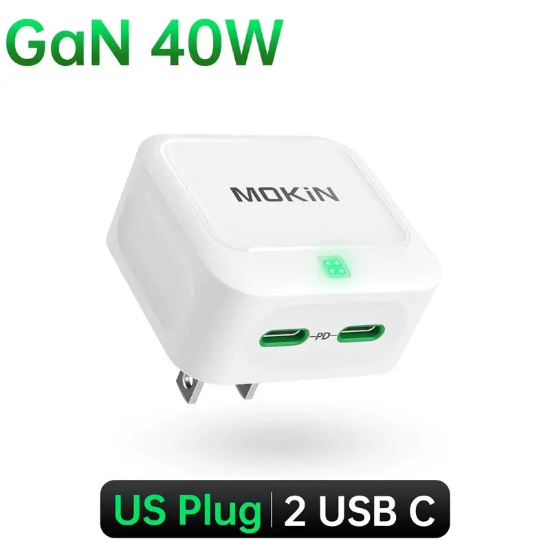 A white usb charger with a green light on top of it