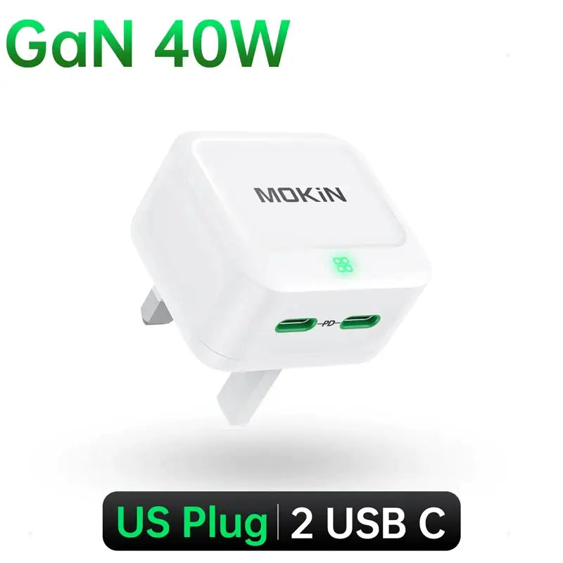 A white usb charger with a green light on top of it