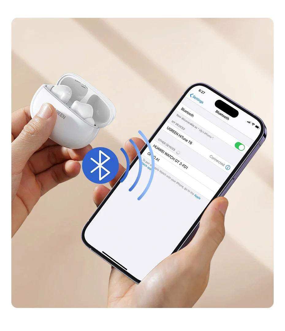 White wireless earbuds with charging case connected to a smartphone via Bluetooth.