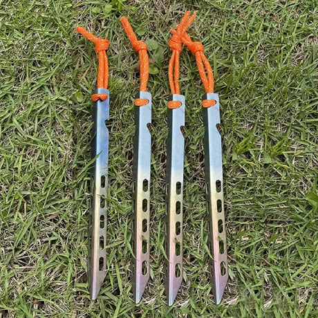 two knives laying on the grass