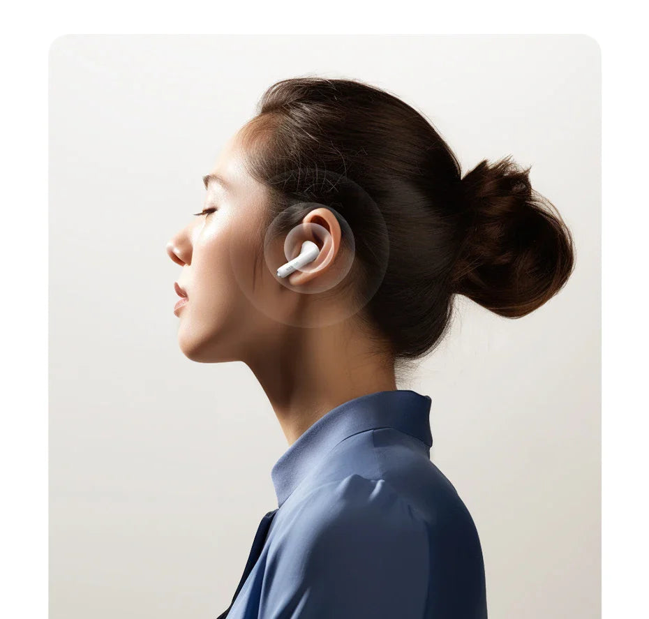 Wireless earbud in use.