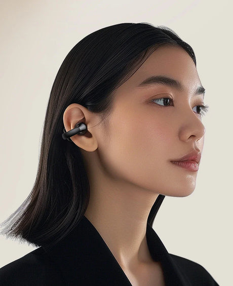 Wireless earbuds with ear clip.