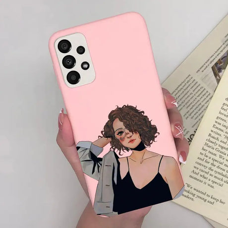 a woman in a black dress holding a pink phone case