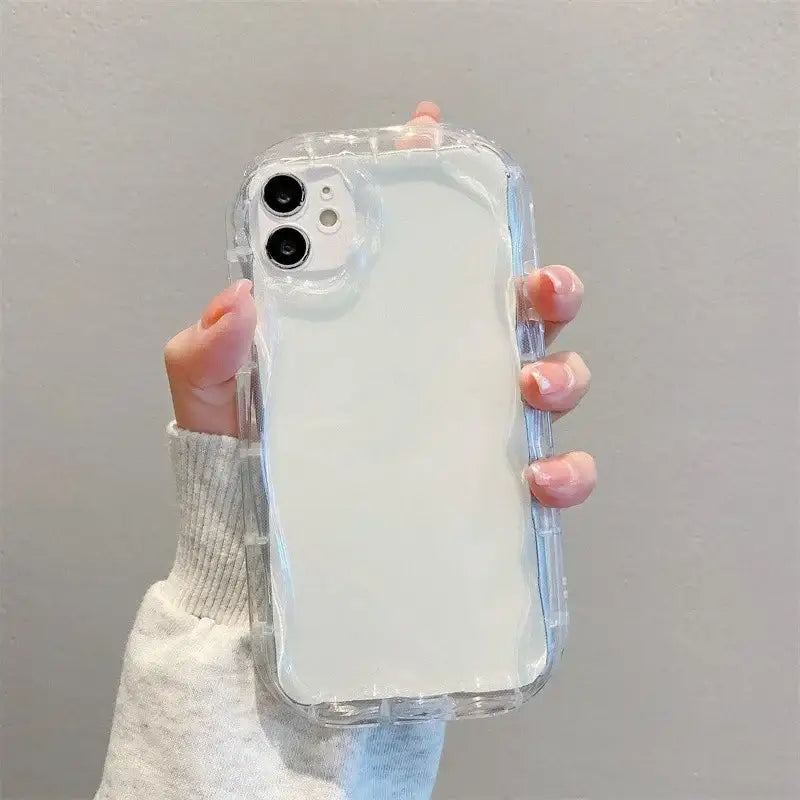 A woman holding a clear case for the iphone