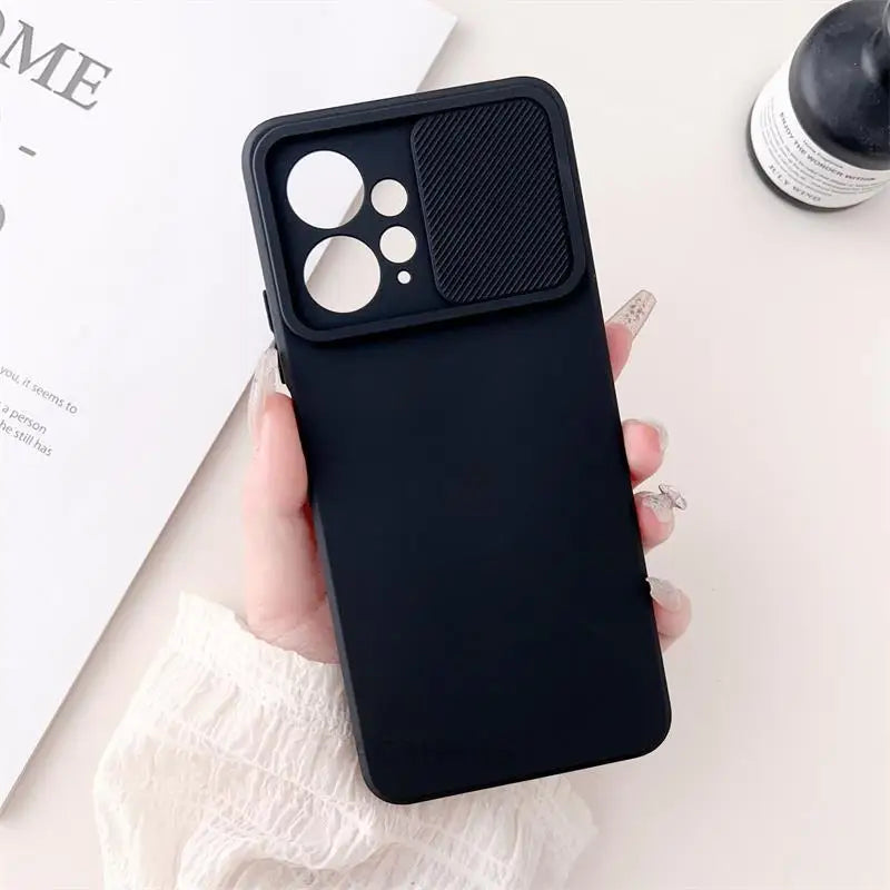 a person holding a black iphone case