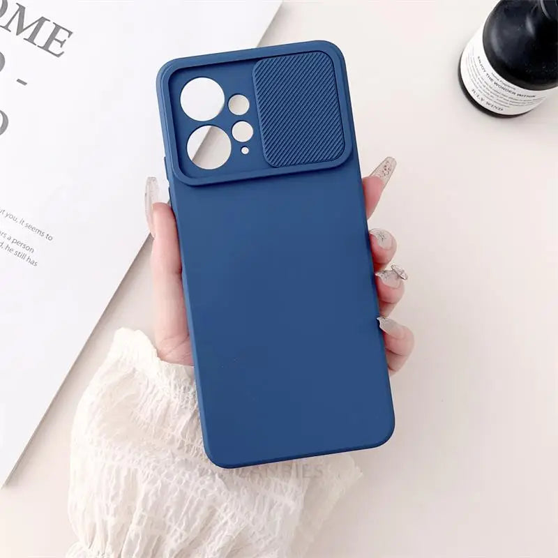 a woman holding a blue iphone case