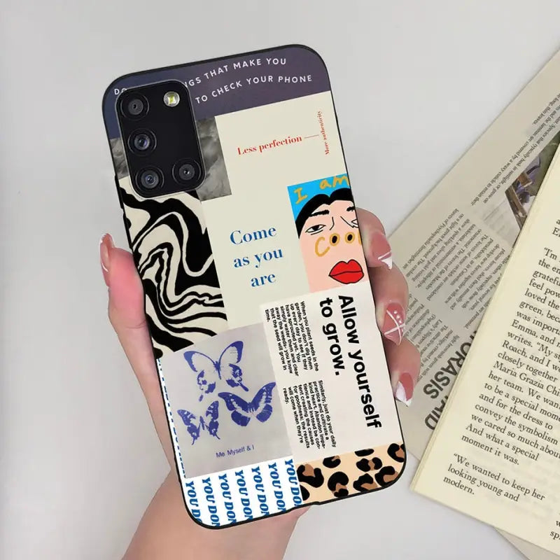 a woman holding a book and a phone case