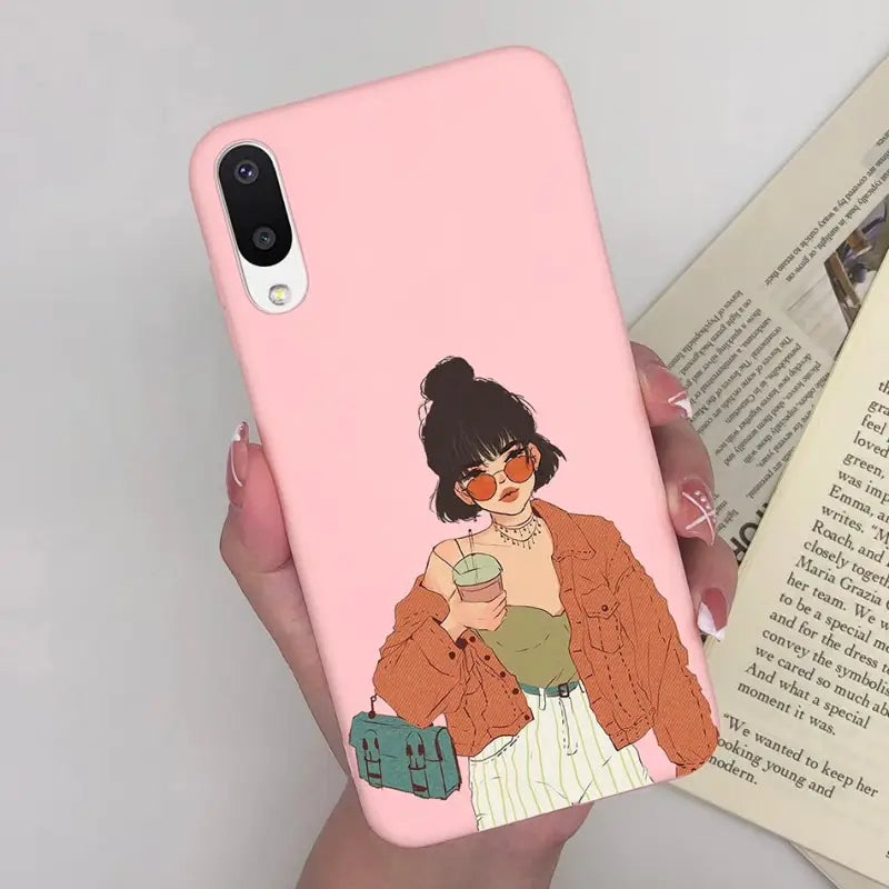 a woman holding a cup of coffee while she is reading a book