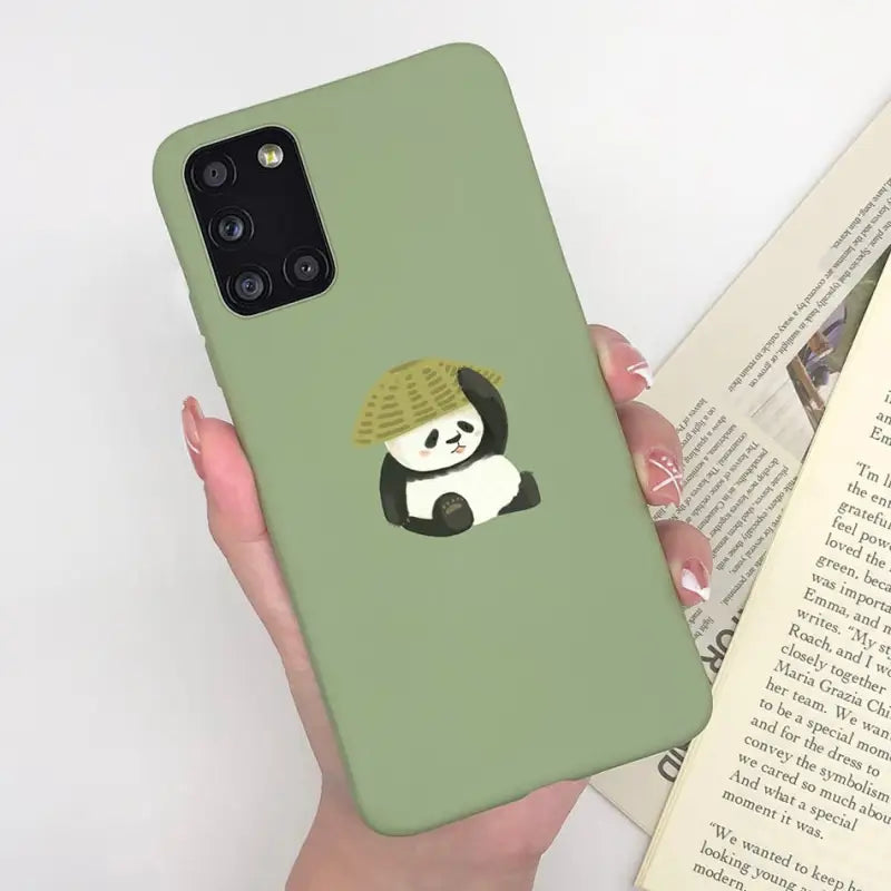 a woman holding a book and a phone case