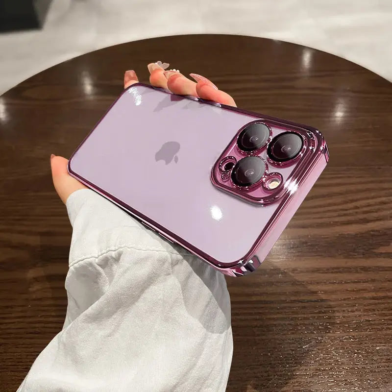 a woman holding a purple iphone case