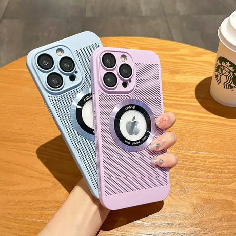 a woman holding a pink iphone case with a camera