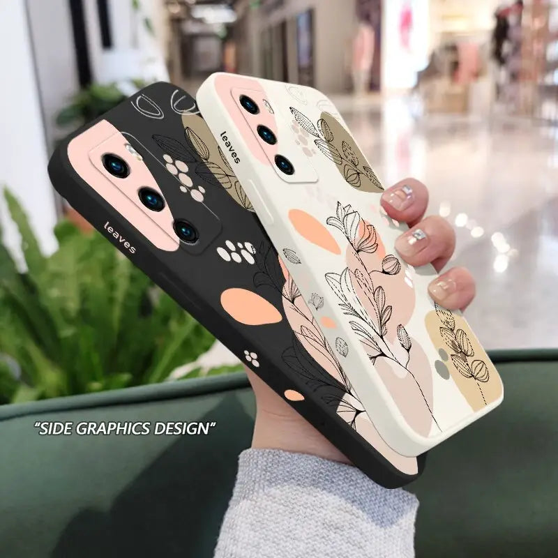 a woman holding a phone case with a flower pattern