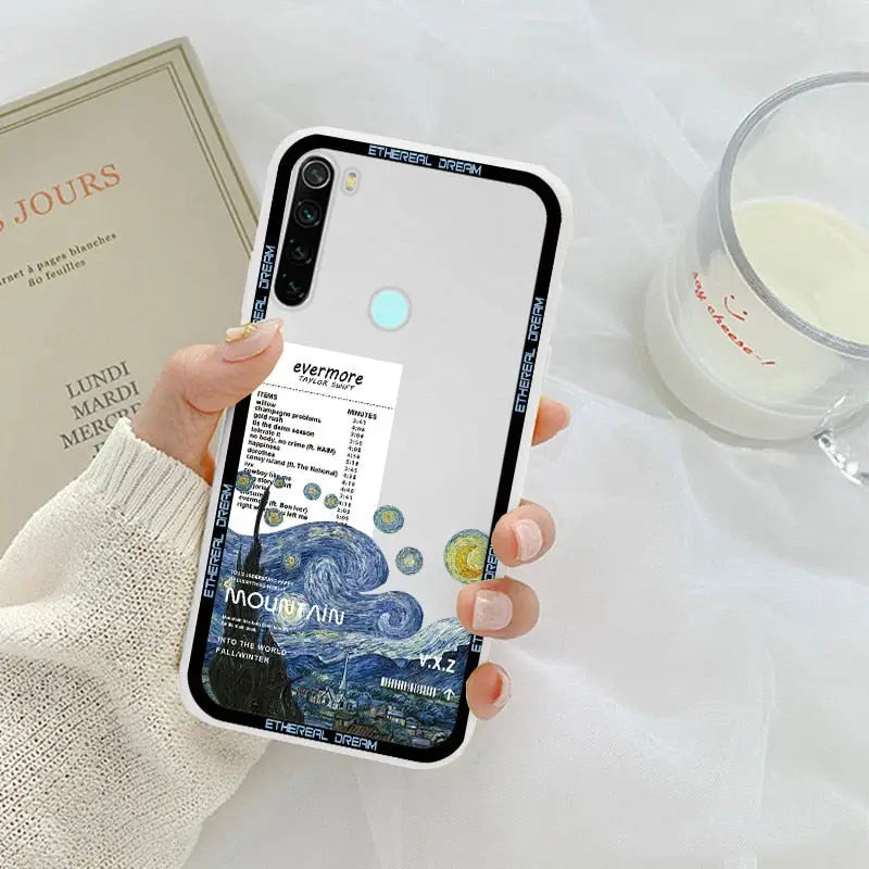 a woman holding a phone case with a picture of a starr