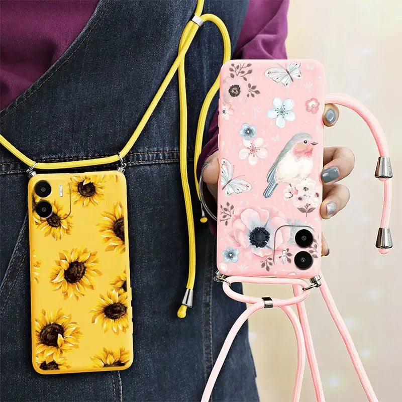 a woman holding a phone case with sunflowers on it