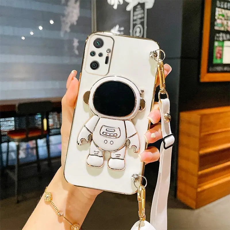 a woman holding a phone case with a cartoon character on it