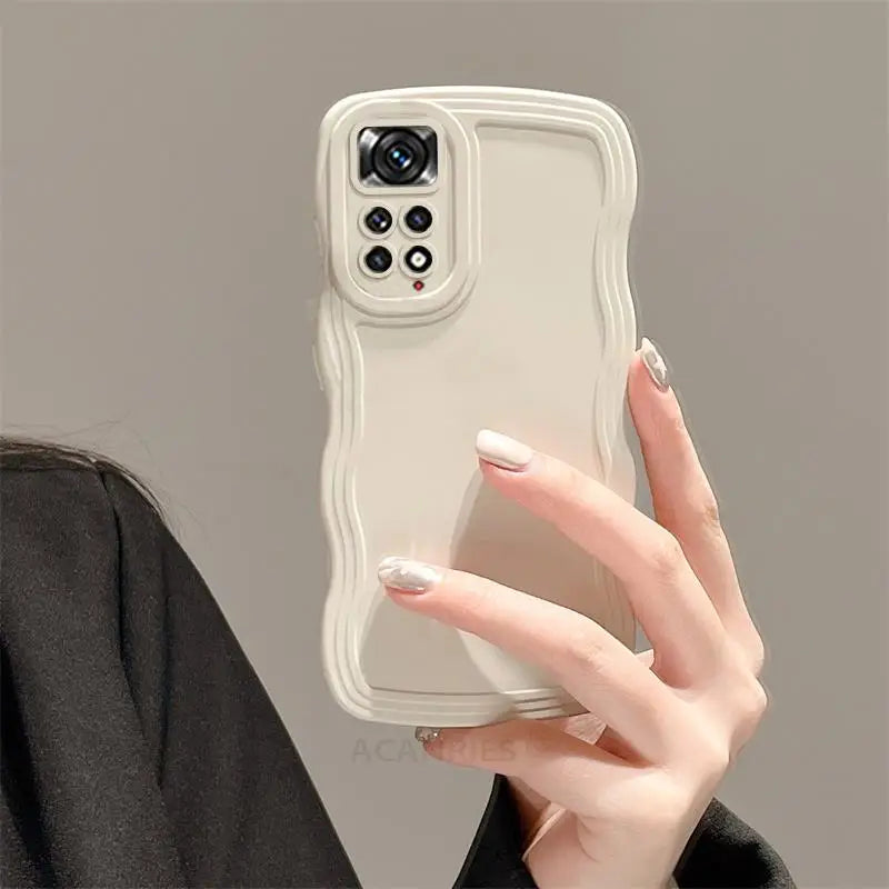 a woman holding a phone case in her hand