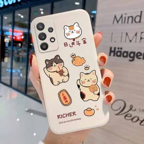a woman holding a phone case with a cat and dog sticker on it