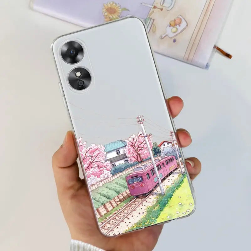 a woman holding a phone case with a painting of a train