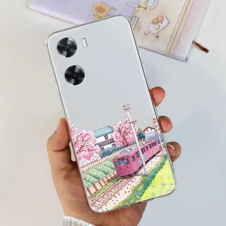 a woman holding a phone case with a painting of a train