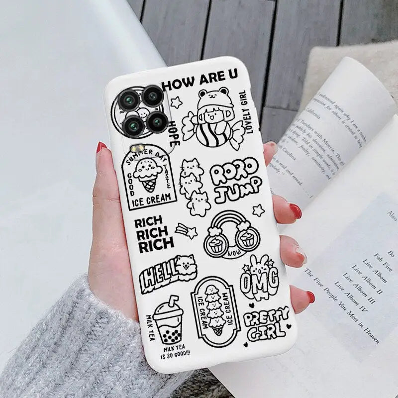 a woman holding a phone case with cartoon drawings on it