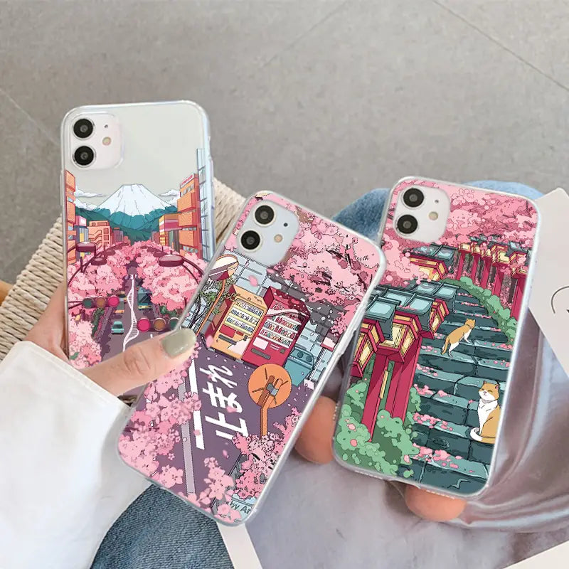 a woman holding a phone case with a pink flower pattern