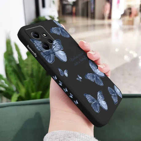 a woman holding a phone case with a blue flower pattern