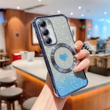 a woman holding a phone case with a glitter effect