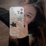 a girl holding a phone case with a star design