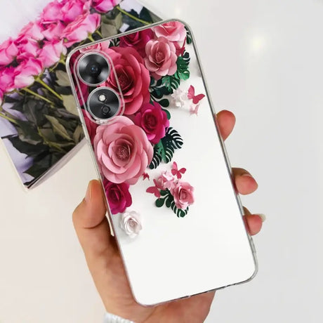a woman holding a phone case with flowers on it