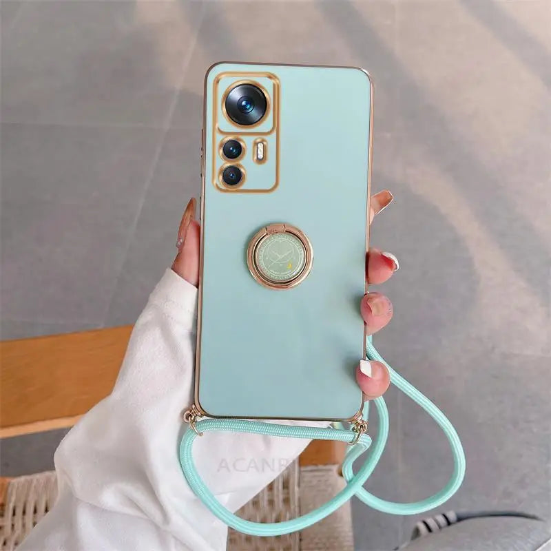 a woman holding a phone with a ring around her neck