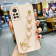 a woman holding a phone case with a ring on it