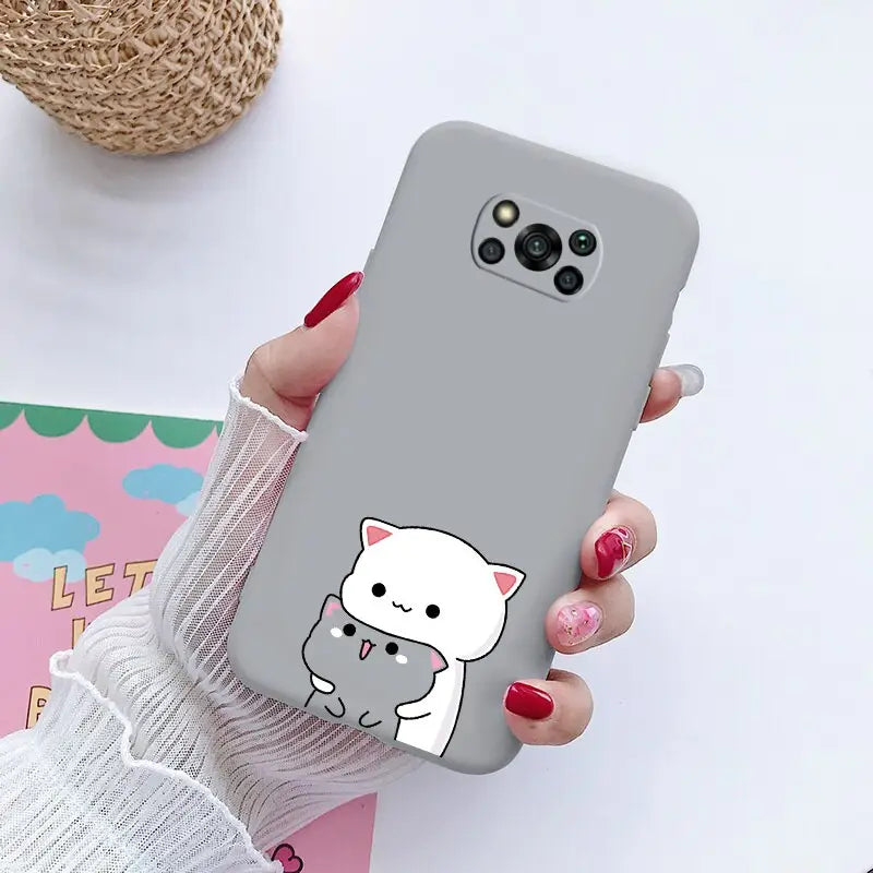 a woman holding a phone case with a cat on it