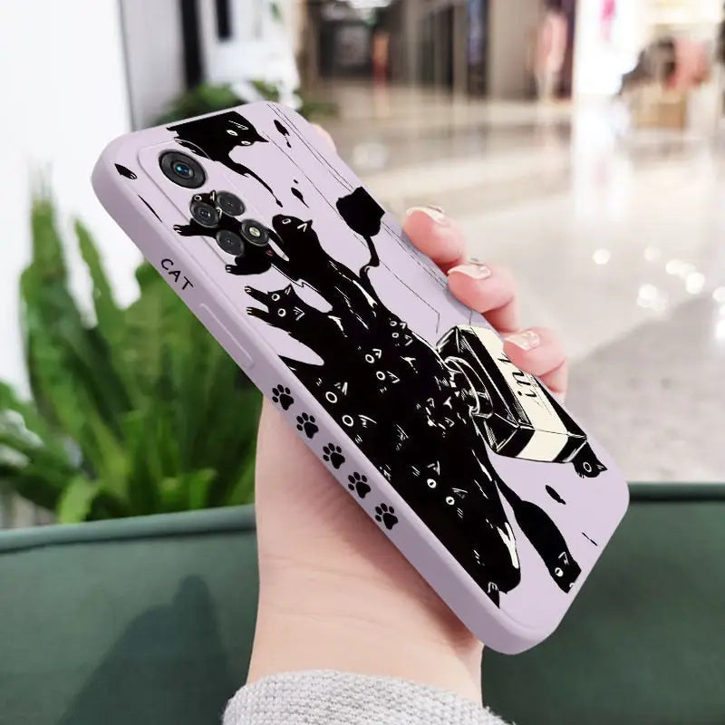 a woman holding a phone case with a black and white drawing of a woman