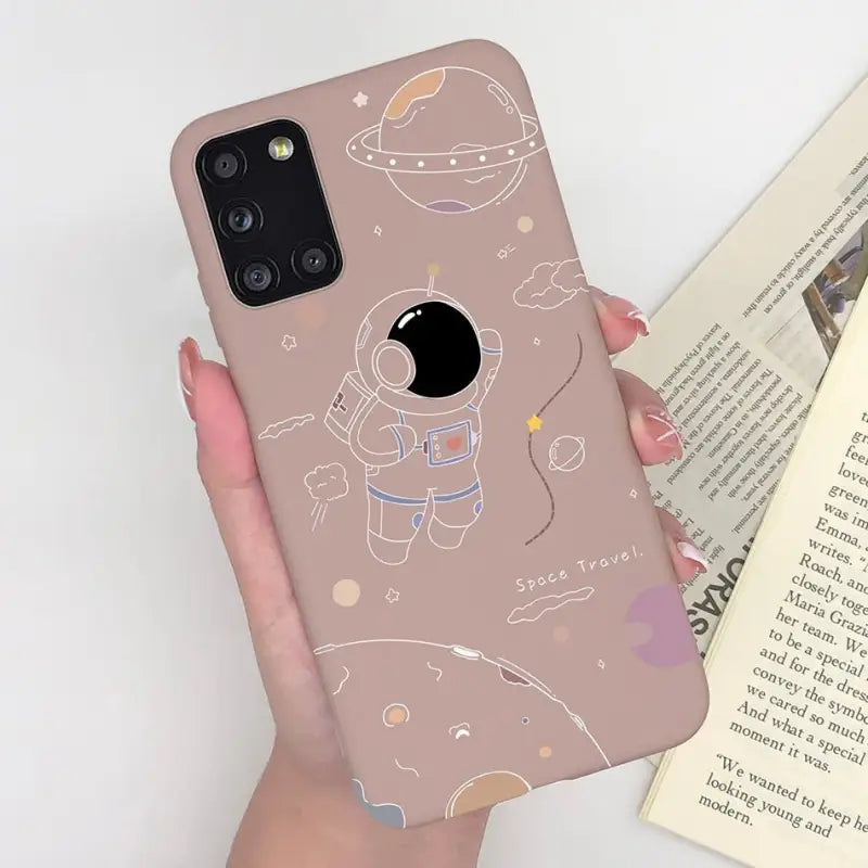 a woman holding a phone case with a cartoon character on it