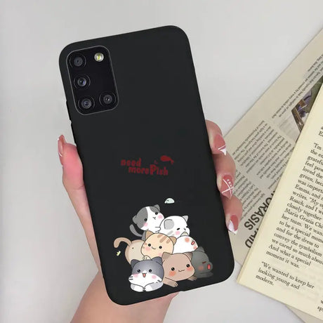 a woman holding a phone case with a cartoon character