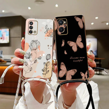 a woman holding up a phone case with a floral design