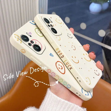 a woman holding a phone case with a colorful pattern