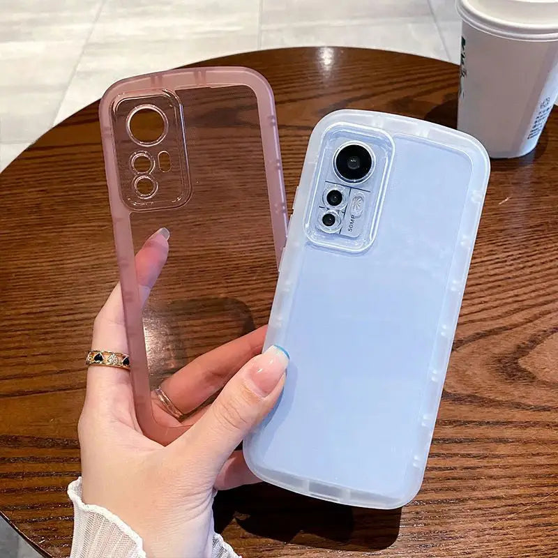 a woman holding a phone case on her finger