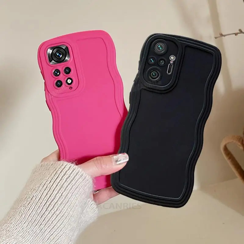 a woman holding a pink iphone case