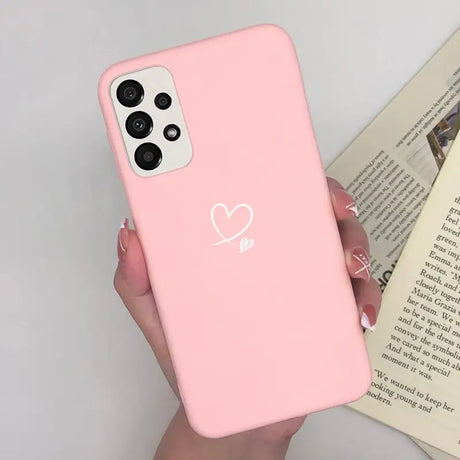 a woman holding a pink iphone case