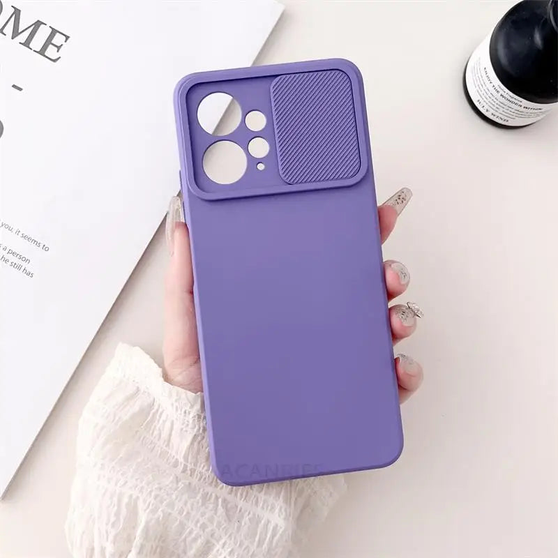 a woman holding a purple iphone case